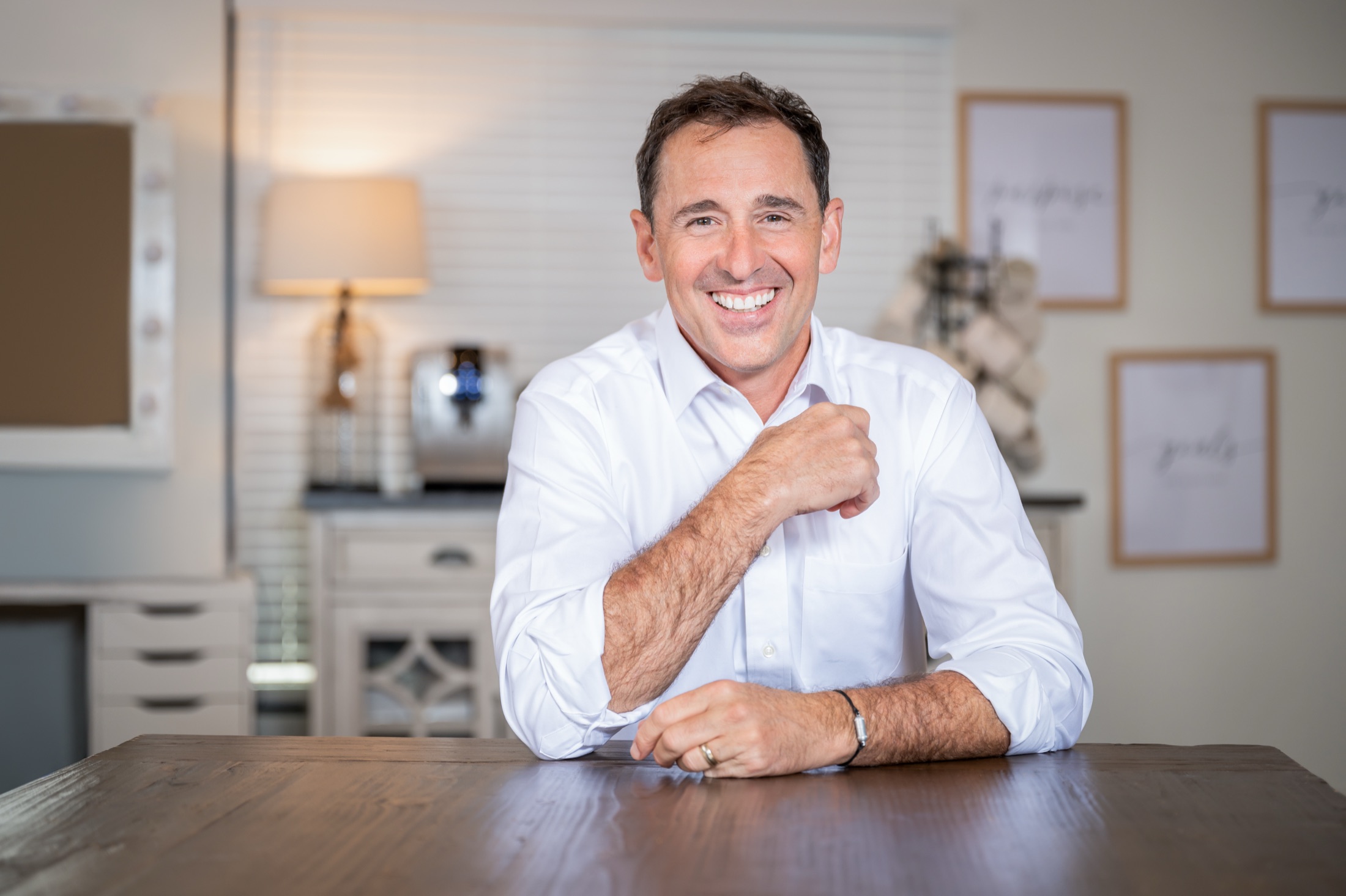 Sean smiling in a home office setting