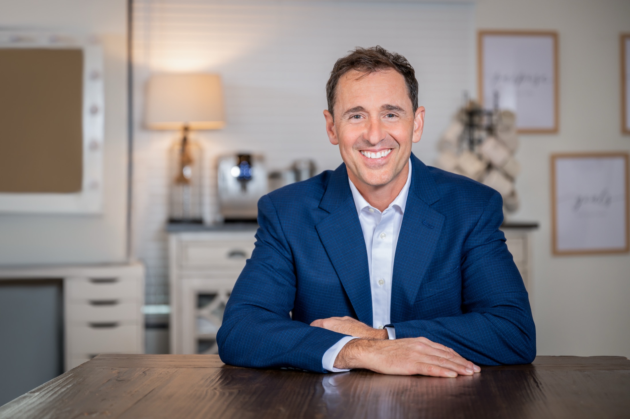 Sean seated in a home interior